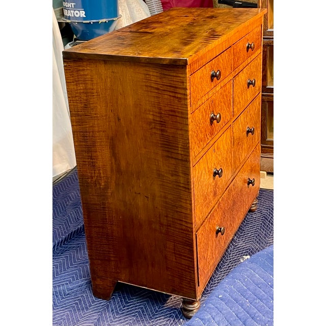 A Timeless Treasure: The Antique Curly Maple Chest of Drawers Step back in time and behold a masterpiece of American...