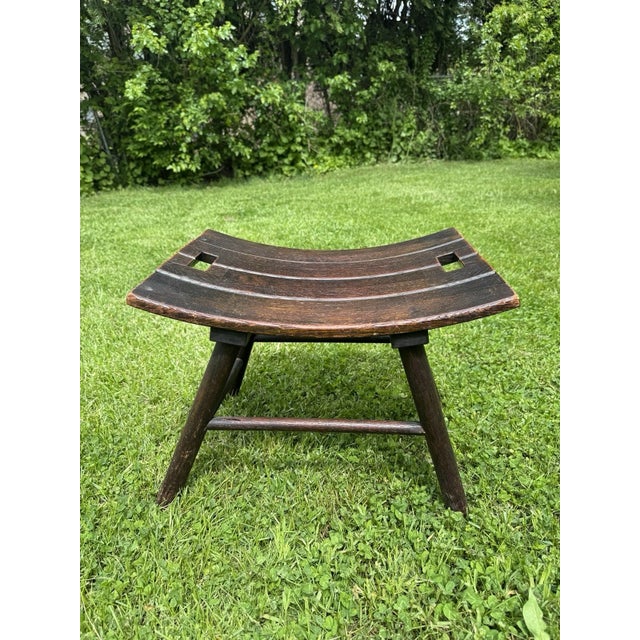 Beautiful mid-century Arts & Crafts style solid oak bench/stool featuring a curved seat and rustic handmade construction....