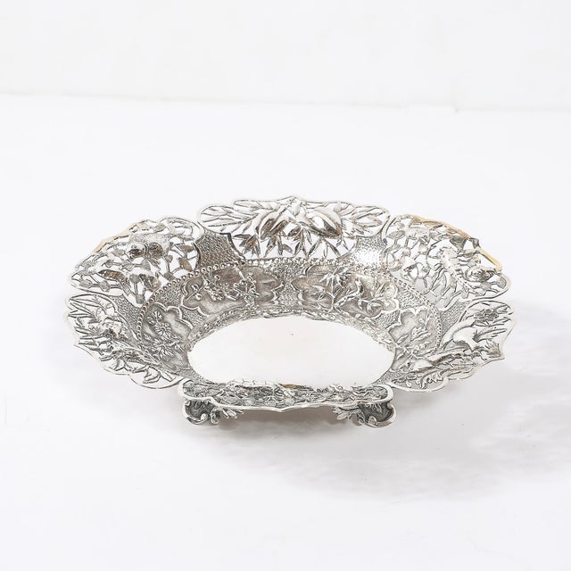 This rare and exquisite Aesthetic Movement footed dish, crafted in sterling silver by Pau Kuang in China circa 1890,...