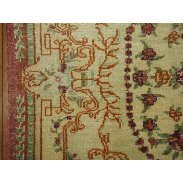 Exquisite Turkish ghiordes weave. Ivory field with splashes of raspberry and celadon green.