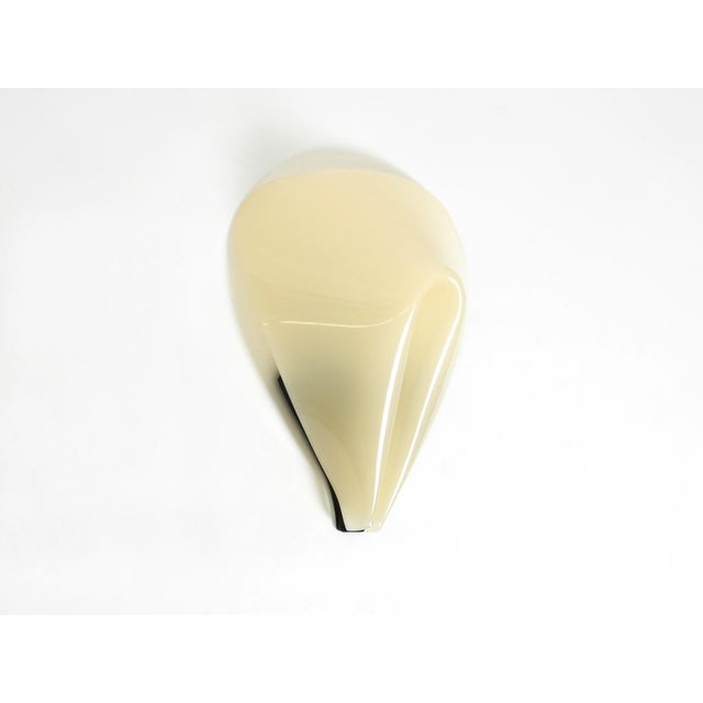 Rare large Mid-Century Modern wall lamp made of beige acrylic glass. Typical abstract organic 1950s design. Acrylic glass...