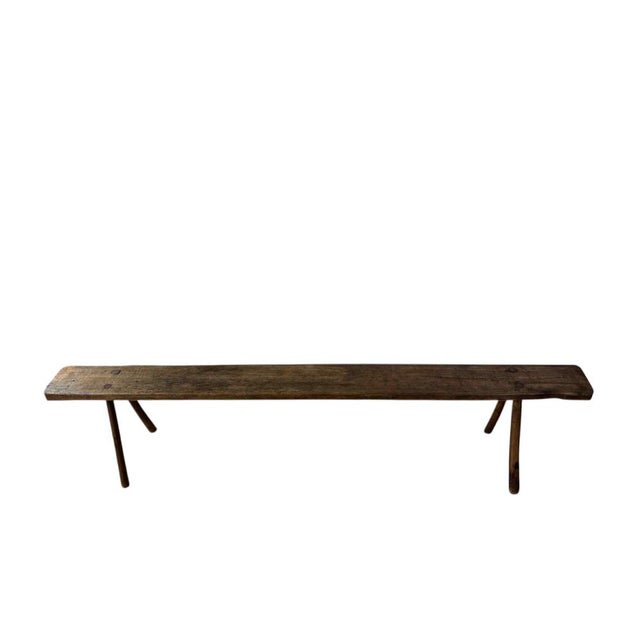 Charming 19th-century French antique bench exudes rustic simplicity and timeless character. Handcrafted from solid wood,...