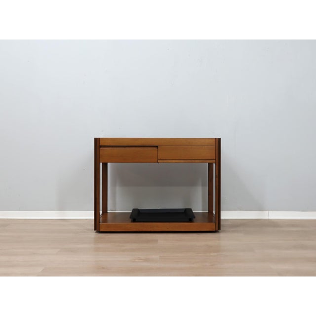 Are you seeking a vintage piece that embodies the perfect balance between rationalist precision and warm materiality? this...