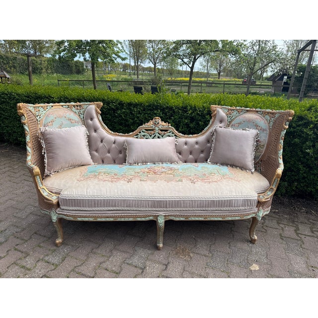 A rare and highly decorative 1940 French Louis XVI-style salon set, consisting of one elegant corbeille sofa and four...