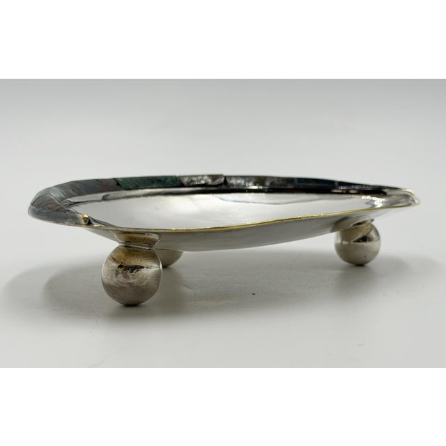 A sculptural Mexican Modernist tripod catchall or decorative bowl by Los Castillo, handcrafted in Taxco, Mexico, circa...