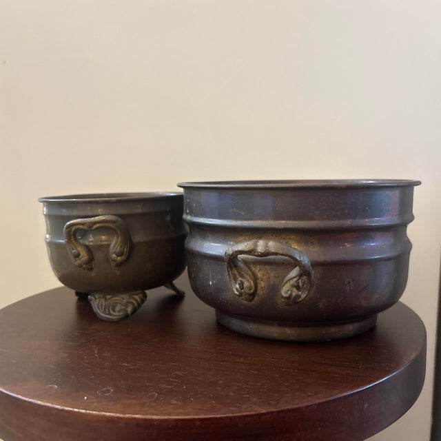 Charming pair of vintage Indian decorative vessels in an aged antique-brass finish, featuring two complementary forms and...