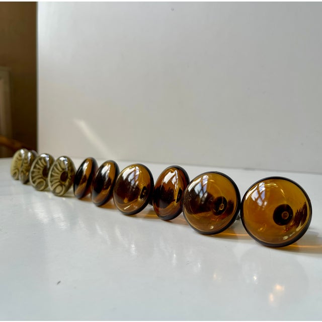 A set of 10 (6/4) glass door/drawer/cabinet knobs. Hand-made in Sweden during the 1960s. Measurements: Dept: 5.5 cm, W/H:...