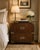 An exceptional vintage nightstand by Baker Furniture, crafted in the iconic Campaign style with a touch of Hollywood...
