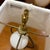A distinctive Waterford crystal and brass swing-arm lamp featuring a tall cylindrical column of clear lead crystal cut...