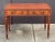 A fine period English writing table or desk of mahogany from the Regency Era, circa 1825, featuring an inset rectangular...