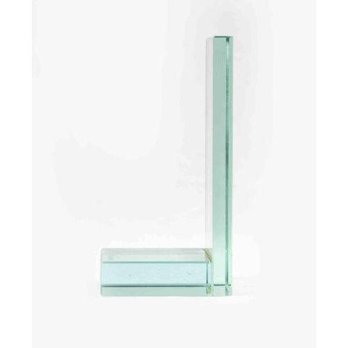 Glass bookend is an original decorative object realized in the 1970s. A mid-century bookend entirely realized in glass....