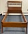 A handsome pair of vintage twin-size wooden bed frames featuring a warm medium-brown finish and elegant, understated...