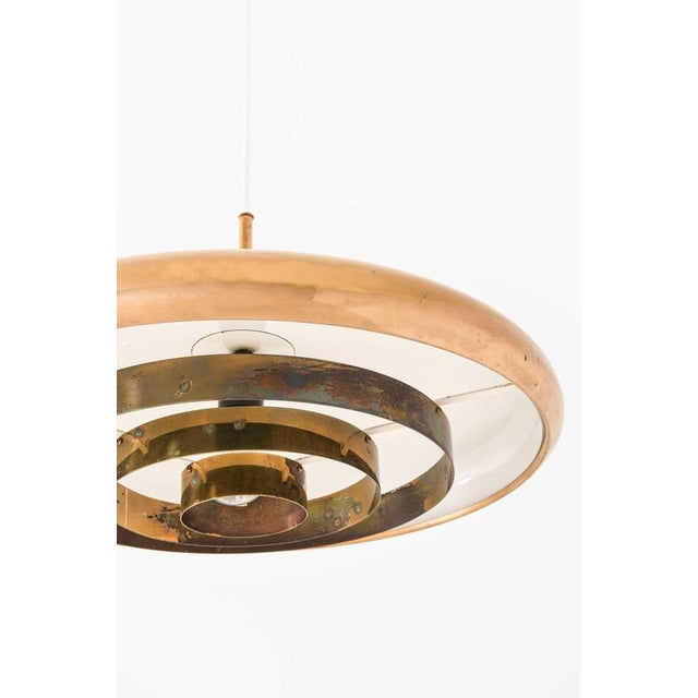 The ceiling lamp model t-5, designed by alf svensson and yngvar sandström and produced by bergboms in sweden, is a...