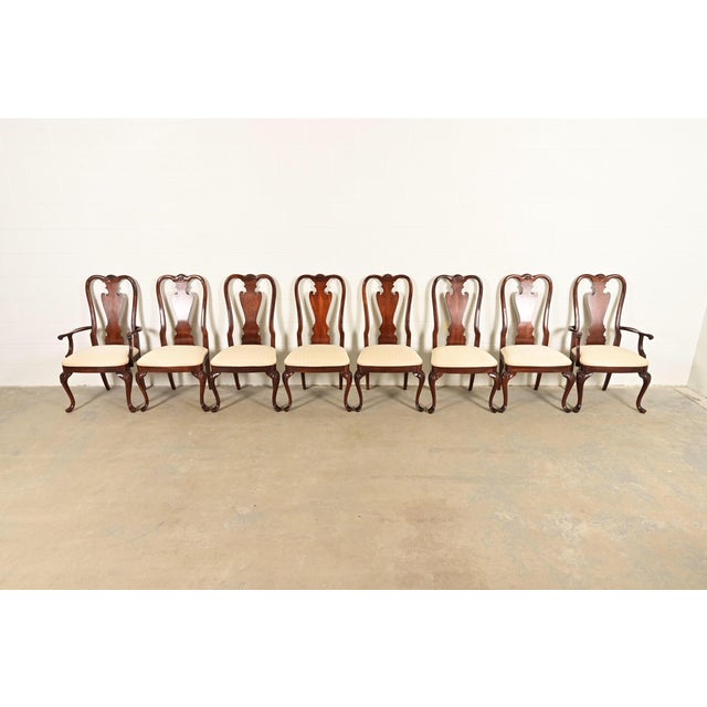 A gorgeous set of eight Queen Anne or Georgian style dining chairs By Thomasville USA, Circa 1980s Solid carved mahogany...