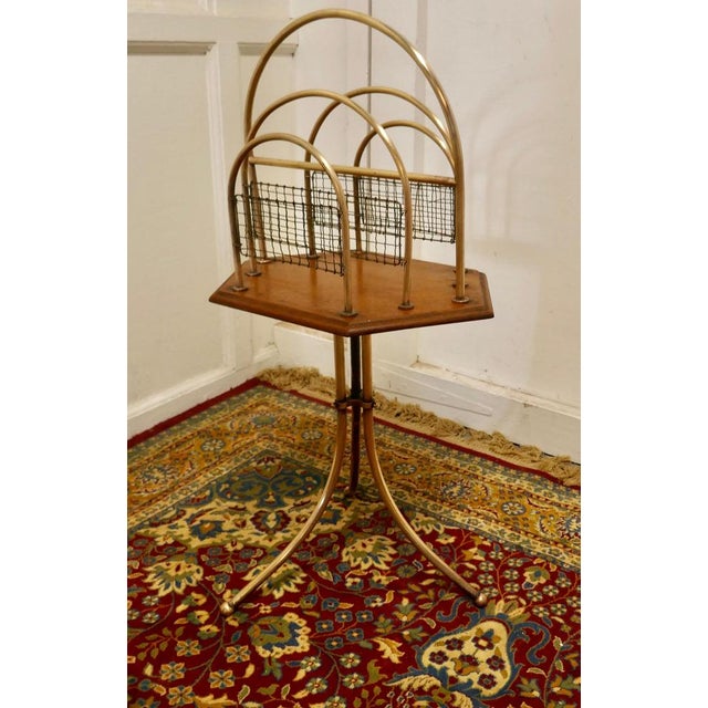 Elegant Victorian Golden Oak and Brass Revolving Magazine Rack This is a very attractive hooped brass magazine rack it is...