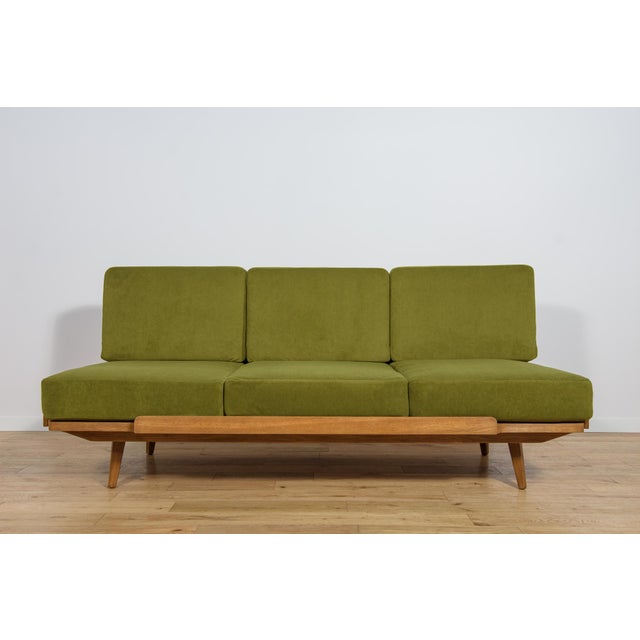 This sofa was produced in Czechoslovakia by Jitona in the 1960s. The wooden structure made of oak veneer has been cleaned...