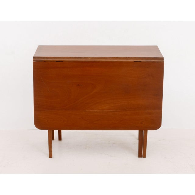 American Mid-Century Modern Diminutive Mahogany Drop-Leaf Table, on four tapered legs with two gate legs, with "Brookline...