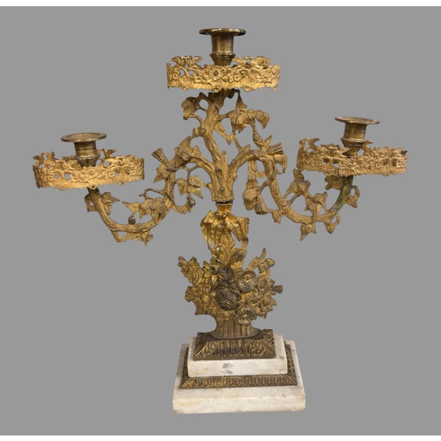 Pair of Victorian 3 Arm Figural Girandole Candelabra With Floral Bouquets I believe this is a matching assembled pair from...