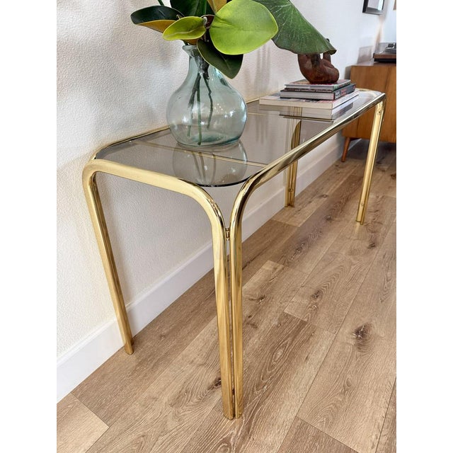 Metal Hollywood Regency Brass Console Table With Smoked Glass Top and Waterfall Edges For Sale - Image 7 of 9