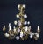 19th century Italian Piedmontese cage form chandelier ornamented with colorful porcelain flowers and hand painted tole...