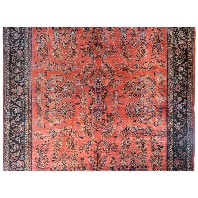 A wonderful early 20th century Persian Sarouk Mahajeran rug with a wonderful all-over mirrored floral pattern woven in...