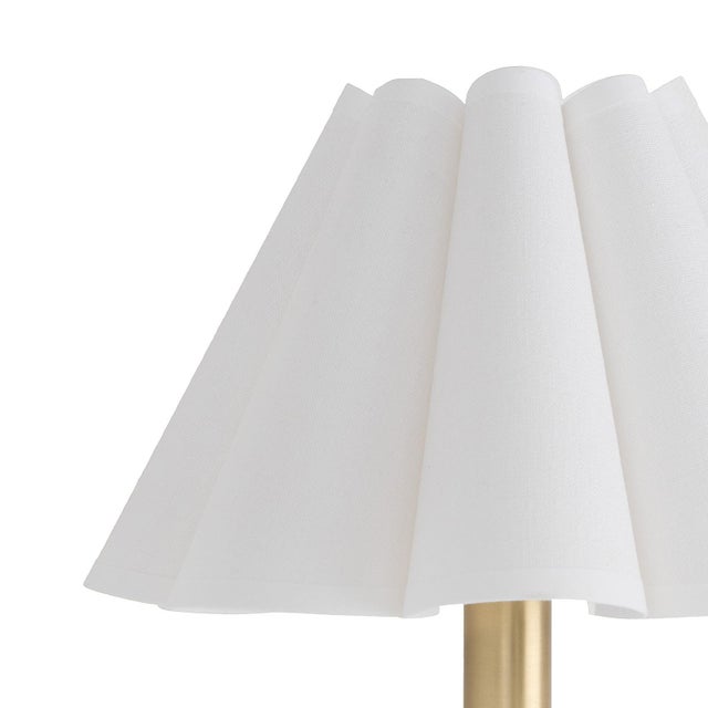 The Polly Wall Sconce brings an air of refined elegance with its single scalloped shade, casting a warm and comforting...