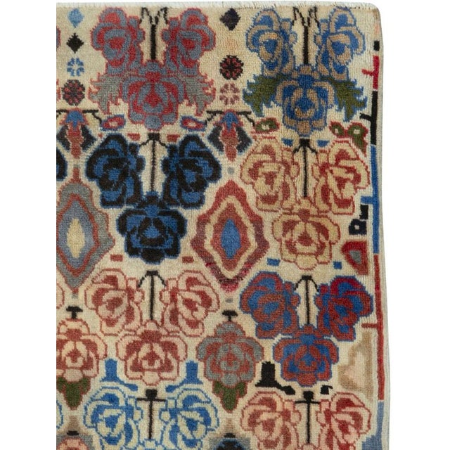 A vintage Persian tabriz rug from the mid-20th century. The city of tabriz is the seat of east azerbaijan province in...