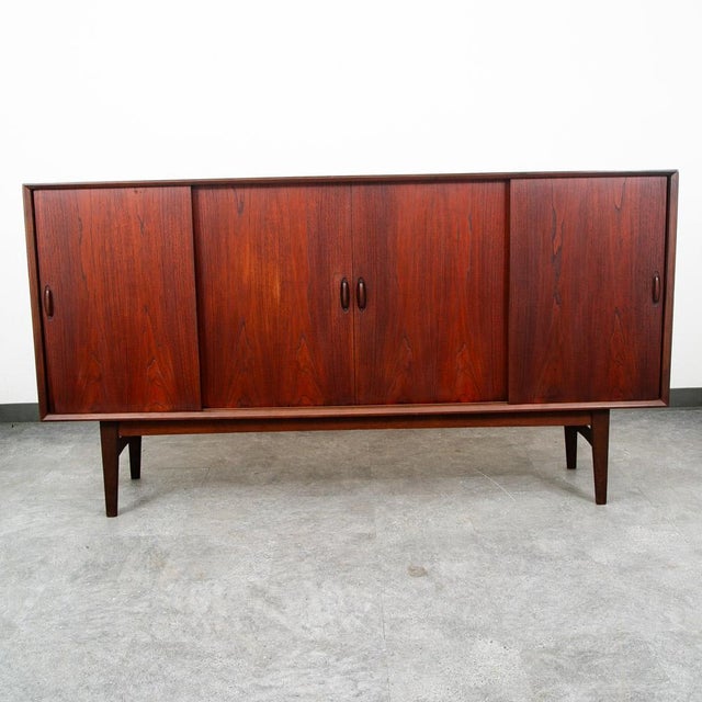 Unique and handsome Danish modern credenza / highboard in teak now. This piece came with our latest shipment straight out...