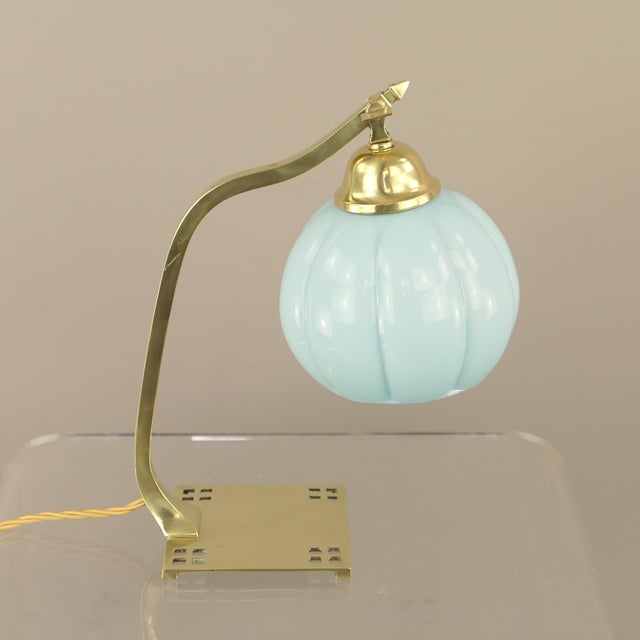 Bedside or table lamp featuring a square brass base (11 x 11 cm) with openwork square cutouts in the corners. Complete...