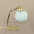 Bedside or table lamp featuring a square brass base (11 x 11 cm) with openwork square cutouts in the corners. Complete...