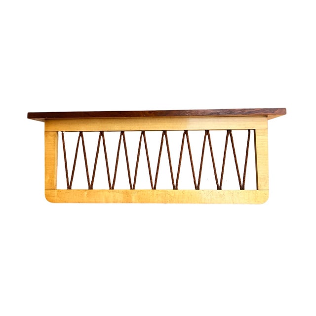 The Brusel style wall hanger was manufactured by Rudi Volket in Germany in the late 1950s. The piece of furniture is...