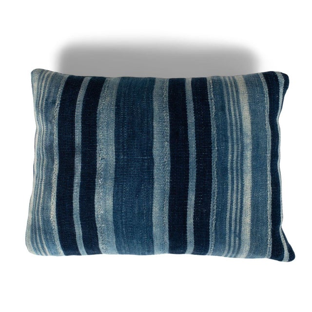 Rich faded indigo stripe cushion made from vintage handwoven and hand-dyed slubby cotton fabric. This decorative pillow...