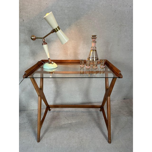 Unique side table in wood and glass. Italian. 1950s. Reminds us of Cesare Lacca. Beautifully finished. Beautiful in its...