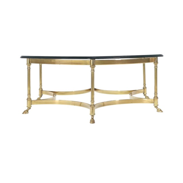Mid-Century Labarge Attributed Hollywood Regency Brass Coffee Table. A beautiful octagonal cut glass sits atop a solid...