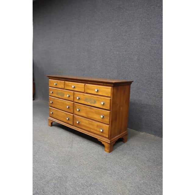 Hitchcock Furniture Company nine-drawer maple dresser featuring traditional Colonial styling and hand-applied floral and...
