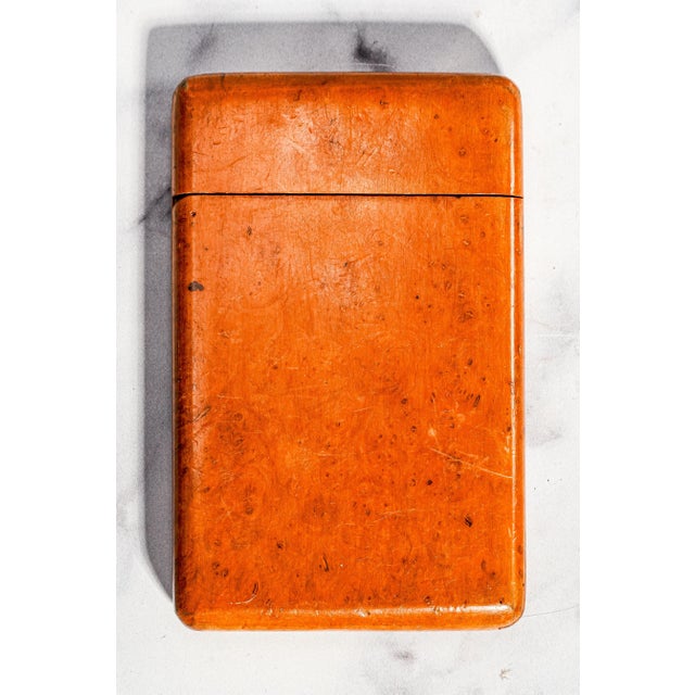 A charming survivor from a bygone era, this antique wooden cigarette case offers wonderful character in a compact,...