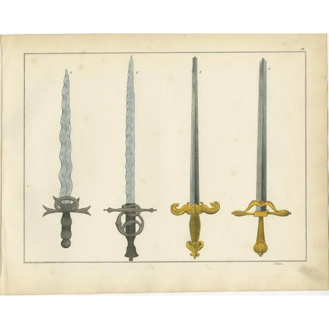 19th-Century Hand-Coloured Lithograph of Ornate Medieval and Renaissance Swords : This elegant hand-coloured lithograph...