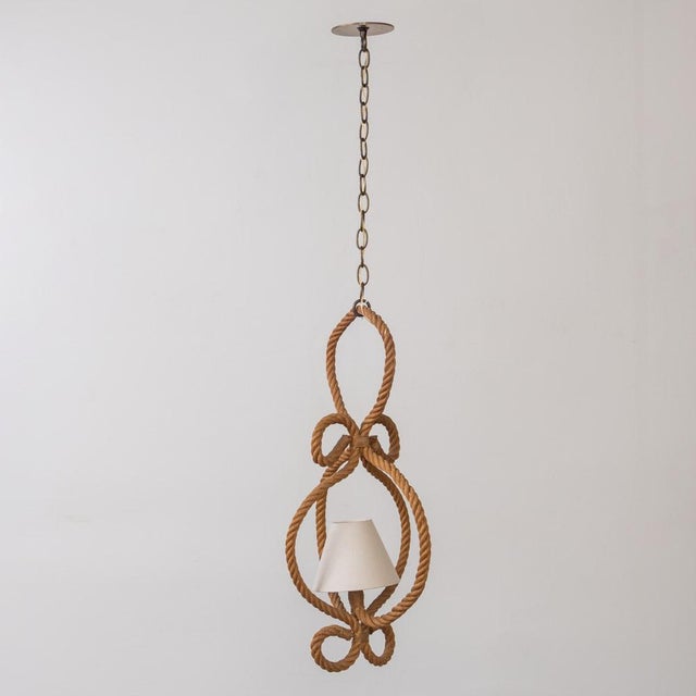 Beautiful pendant light by Adrien Audoux and Frida Minet from France, 1960s. Curved twisted rope oval frame with loop...