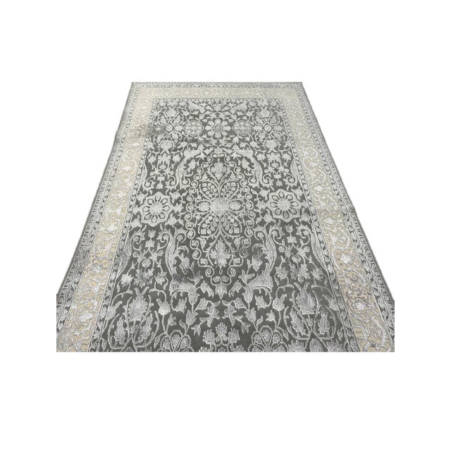 Exact Size: 6'0" x 8'10" Color: Gray Age: New Materials: Wool, Bamboo Silk Construction: Hand Knotted Origin: India