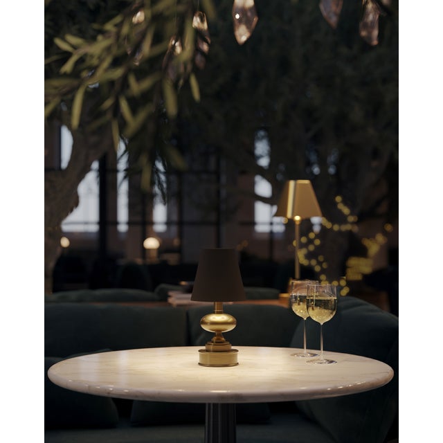 The Galavant Brass Cordless Table Lamp is a petite gold lamp that makes movement a breeze. The rechargeable bulb sits atop...