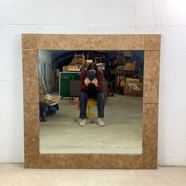 Bring natural texture and quiet sophistication to your space with this large vintage square wall mirror. Wrapped in a...