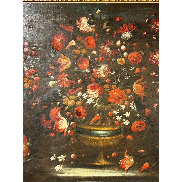 Beautiful still life with vases of flowers placed on different levels and a metal plate holding peaches. The painting is...