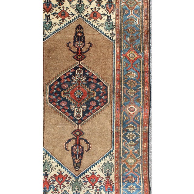 Measures: 3'5 x 6'3. Antique Persian Sarab Rug Featuring Camel Hair Field with Central Medallion. Keivan Woven Arts / rug...