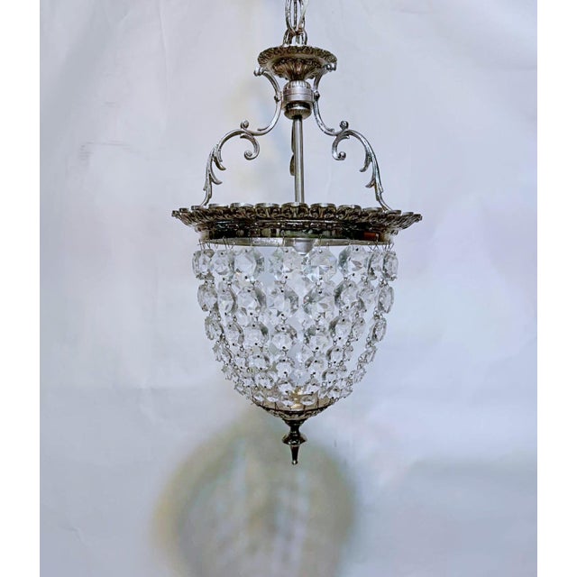 Decorative silver plated basket chandelier with 30% leaded graduated octagon crystal chain. Rewired and restores and it...