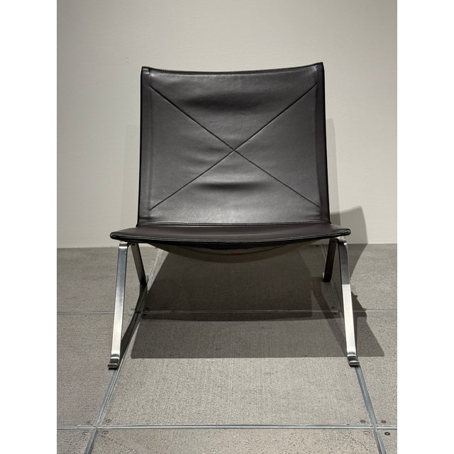 Set of Chocolate Brown Leather PK22 Chairs by Poul Kjærholm for Fritz Hansen, dated 2006 & 2007. The solid brushed-steel...