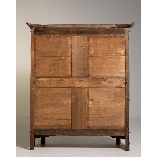 A beautiful antique Provençal oak vitrine from France, circa 1800, featuring a bleached, whitewashed finish that gives the...