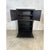 This is a vintage black-painted wooden cabinet with a drop-down door. It has a slightly distressed finish, giving it an...