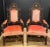 Striking pair of 19th-century French Baroque armchairs, finely carved in dark-stained wood with dramatic, sculptural...