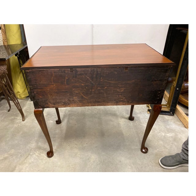 A classic Centennial hand carved mahogany lowboy. The hand carved details on the front, the gadrooned edge at the top and...