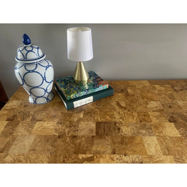 A monumental centerpiece of Postmodern design, this 64-inch dining table perfectly captures the organic modern aesthetic...